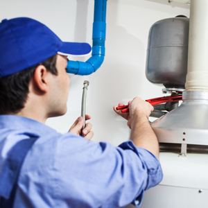 Plumber repairing an hot-water heater