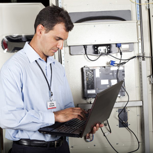 industrial programmer checking computerized machine status